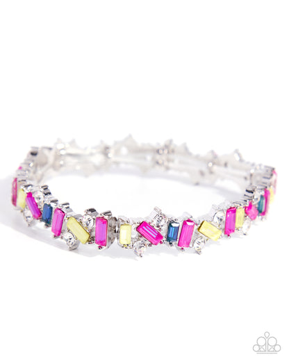 A silver-toned tennis bracelet featuring colorful baguette and round-cut gemstones in pink, yellow, blue, and green, displayed on a clean white background.