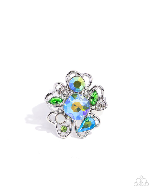 Floral brooch with colorful gemstones on a white background