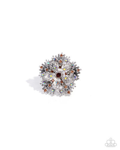 Decorative brooch with multicolored gemstones on a white background