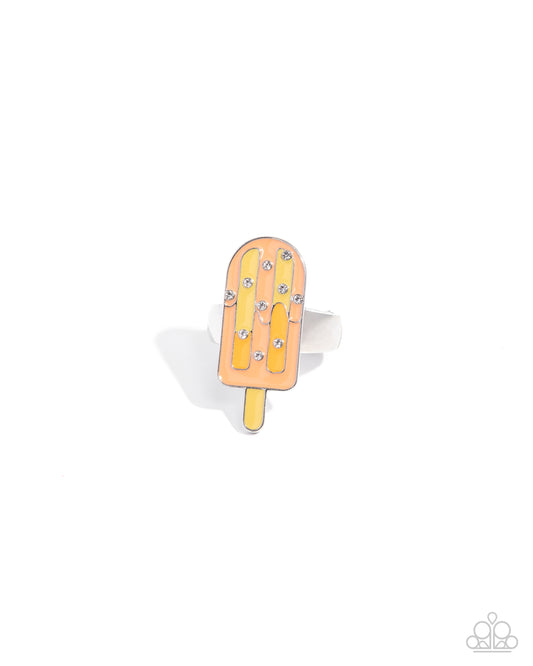 Popsicle-shaped ring with rhinestones on a white background