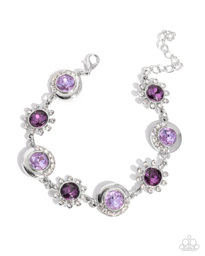 Silver bracelet with purple gemstones on a white background