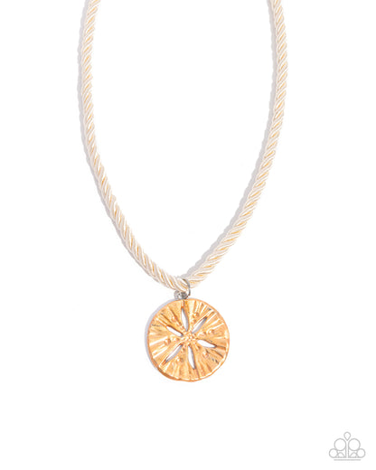 Necklace with a gold circular pendant on a white background