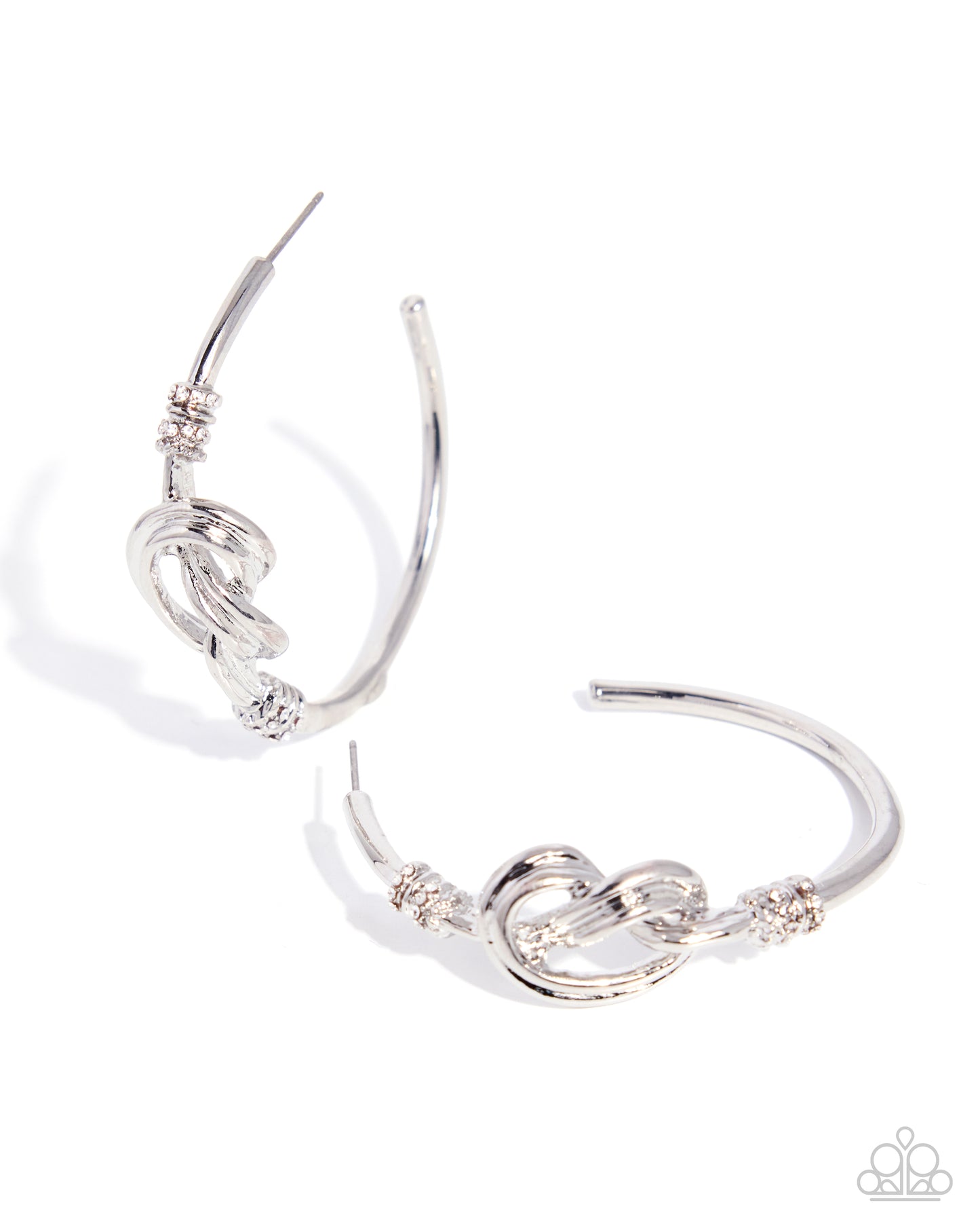 Silver hoop earrings with intricate designs on a white background