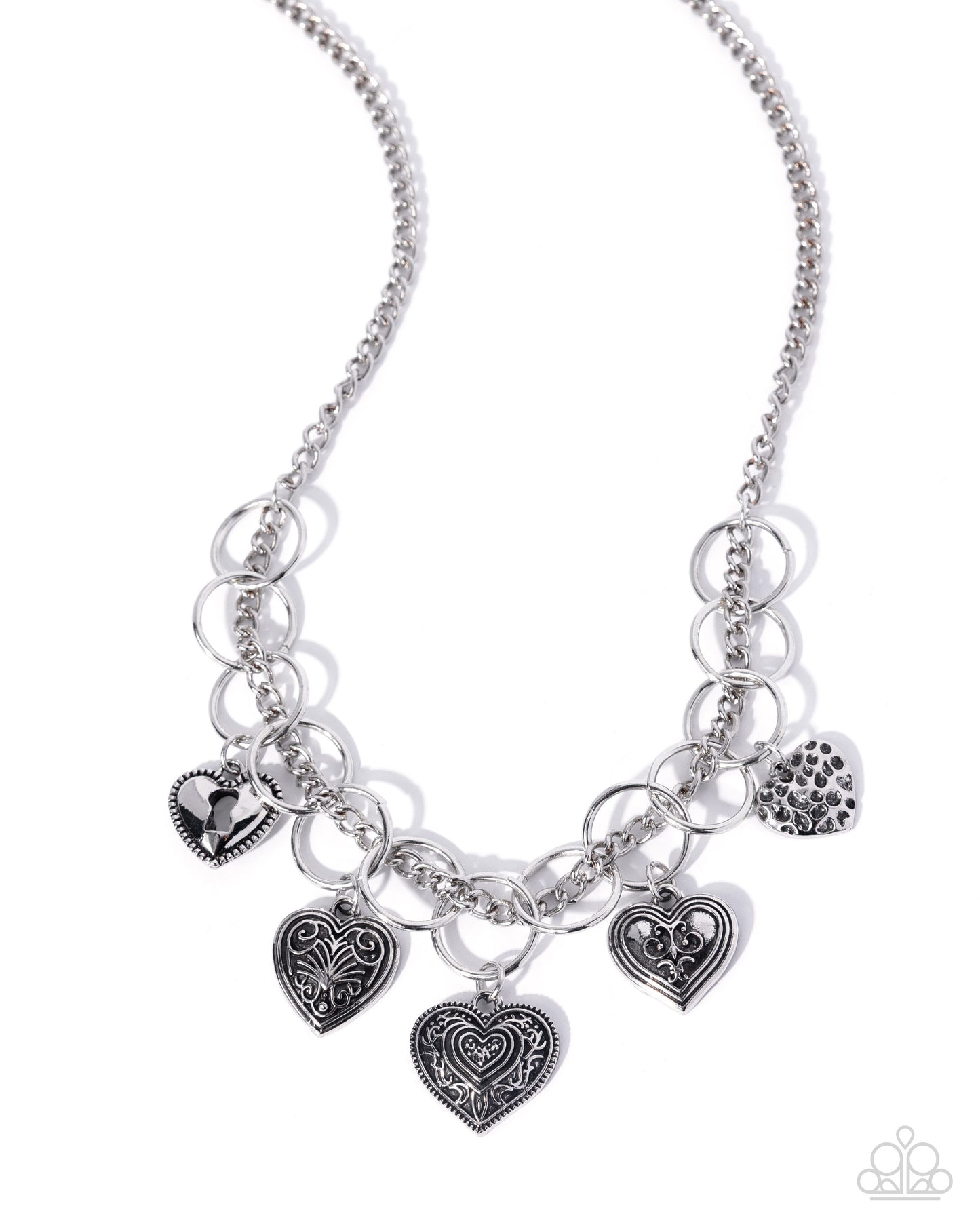 Silver necklace with heart-shaped charms on a white background