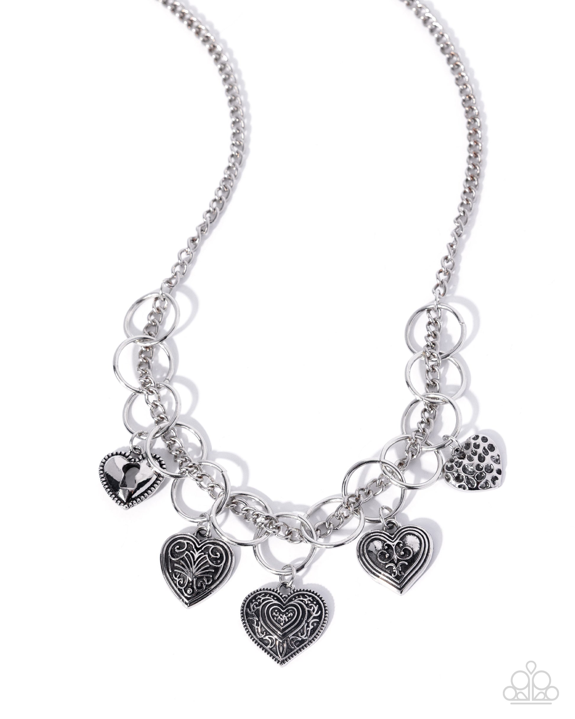 Silver necklace with heart-shaped charms on a white background