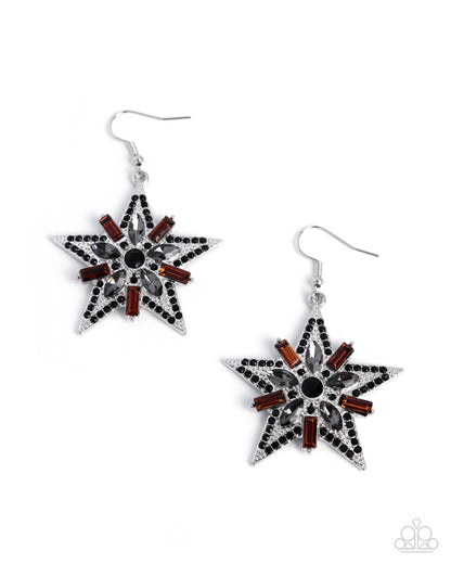 Star-shaped earrings with black, red, and clear stones on a white background