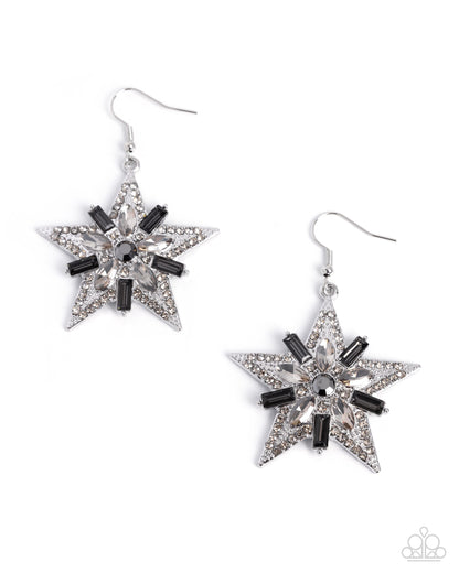 Star-shaped earrings with black and clear gemstones on a white background
