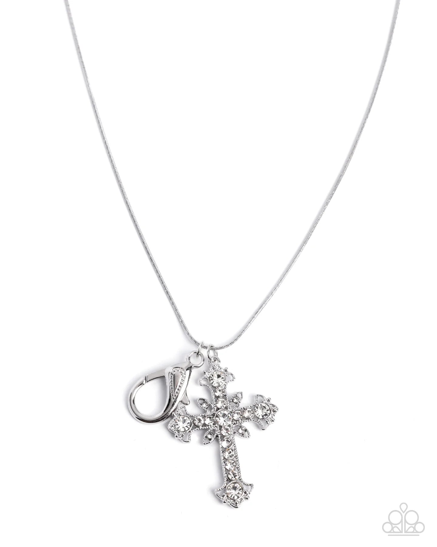 A silver cross pendant necklace adorned with clear rhinestones, shown on a delicate silver chain against a white background. A small silver clasp is attached to the cross.