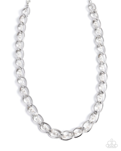 Silver chain necklace on a white background