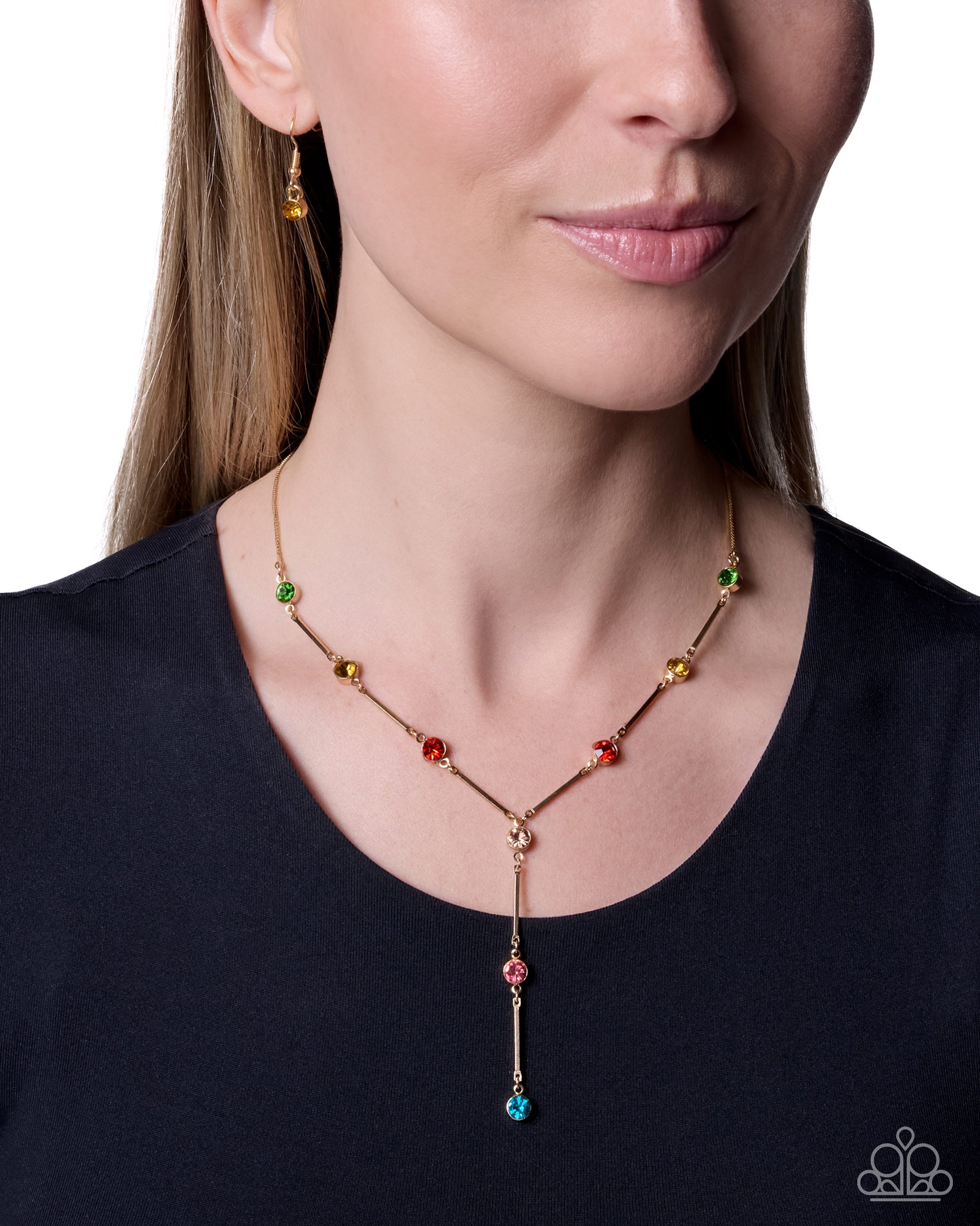 Woman wearing a colorful beaded necklace with a plain background