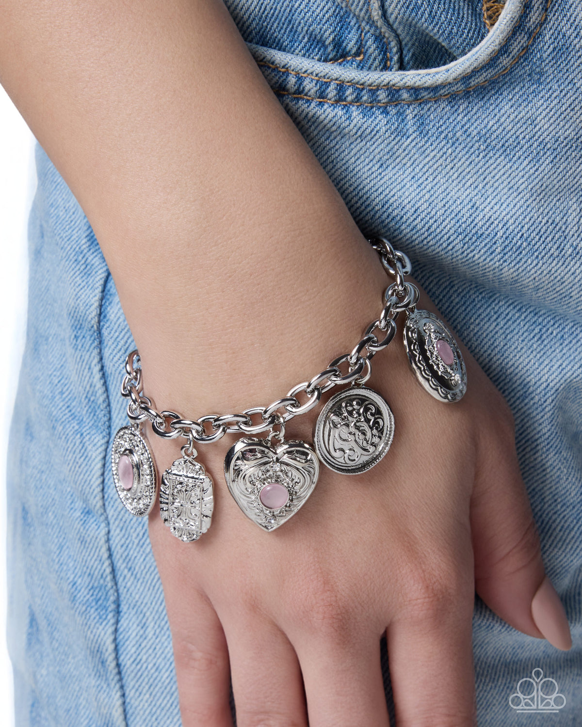Feminine Focus cat's-eye stone and silver charm bracelet detail