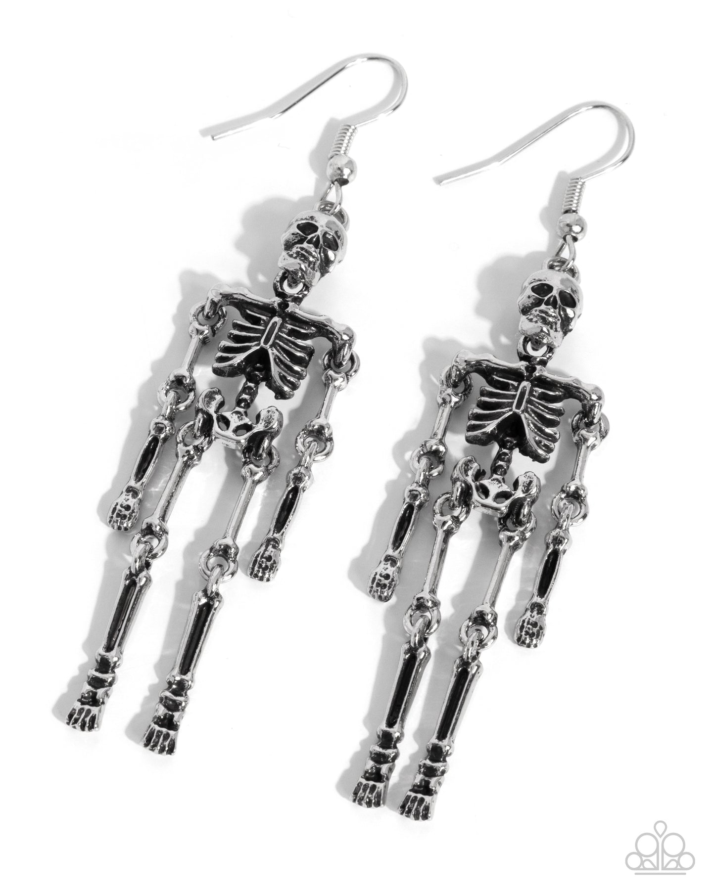 A pair of dangling skeleton earrings in polished silver-tone metal, shown on a clean white background with soft drop shadows. The earrings feature detailed articulated skeleton figures hanging from fishhook wires.