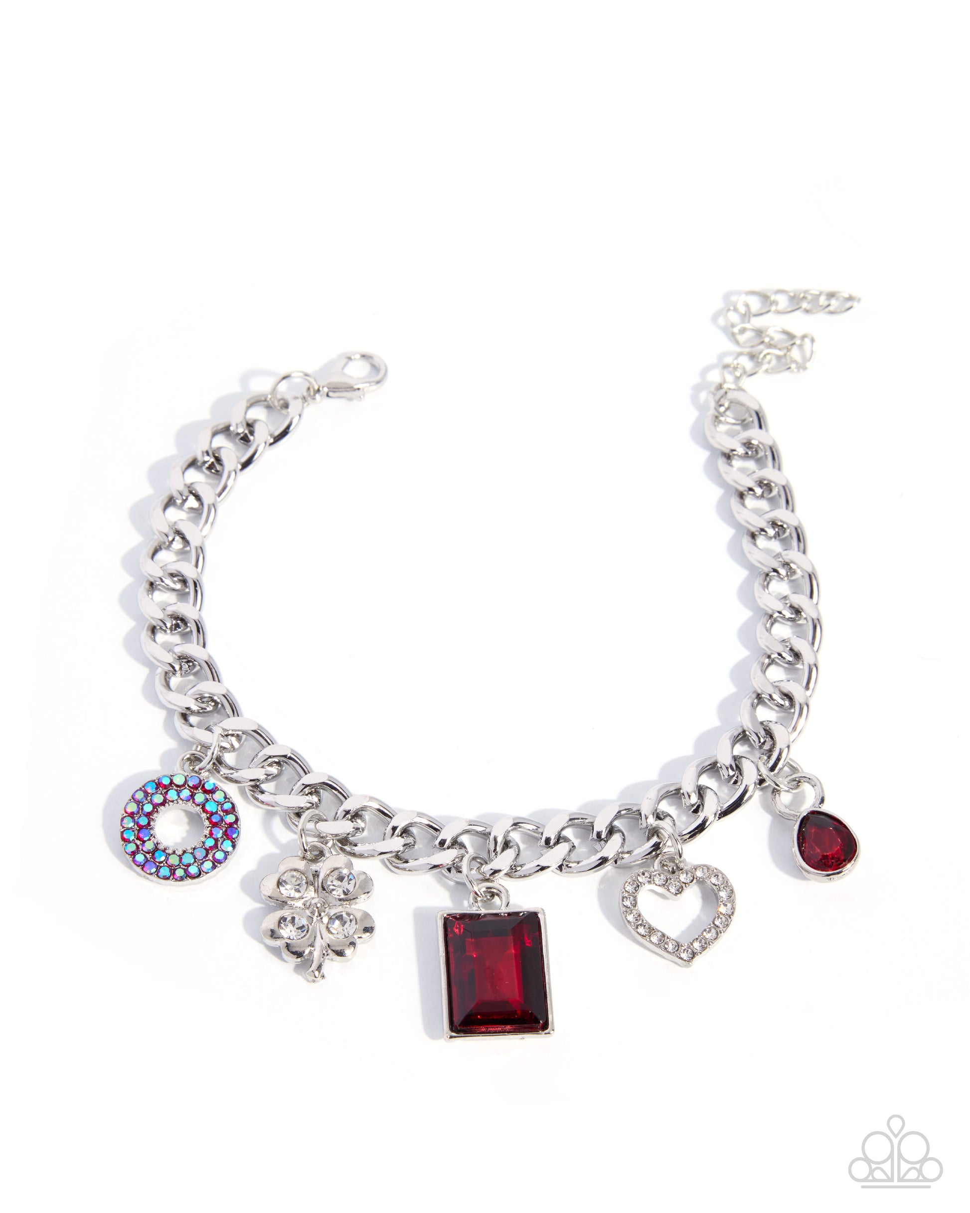 A silver-tone charm bracelet featuring a curb chain, a round rhinestone donut charm, a silver floral charm, a rectangular red gemstone charm, a heart-shaped crystal charm, and a small red gemstone charm, displayed on a clean white background.