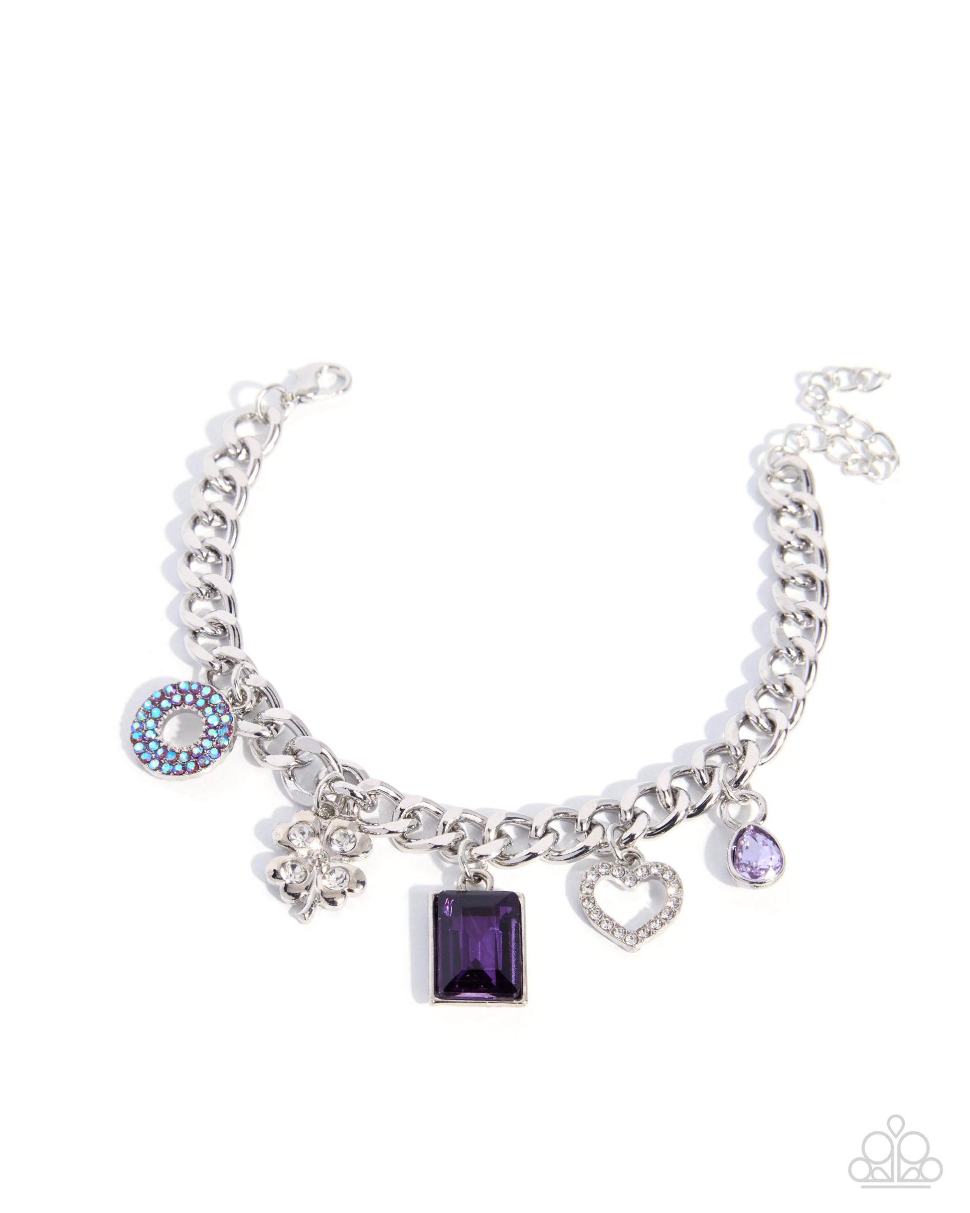 A silver-tone charm bracelet featuring multiple dangling charms, including a central rectangular purple gemstone, a heart-shaped crystal charm, a blue and white evil eye charm, and a small purple oval charm, shown on a plain white background.