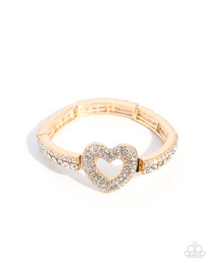 A rose gold bracelet featuring a central heart-shaped pavé centerpiece and matching pavé-set sections on the band, photographed on a clean white background.