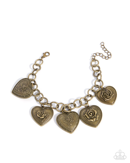Bronze bracelet with heart-shaped charms featuring roses on a white background