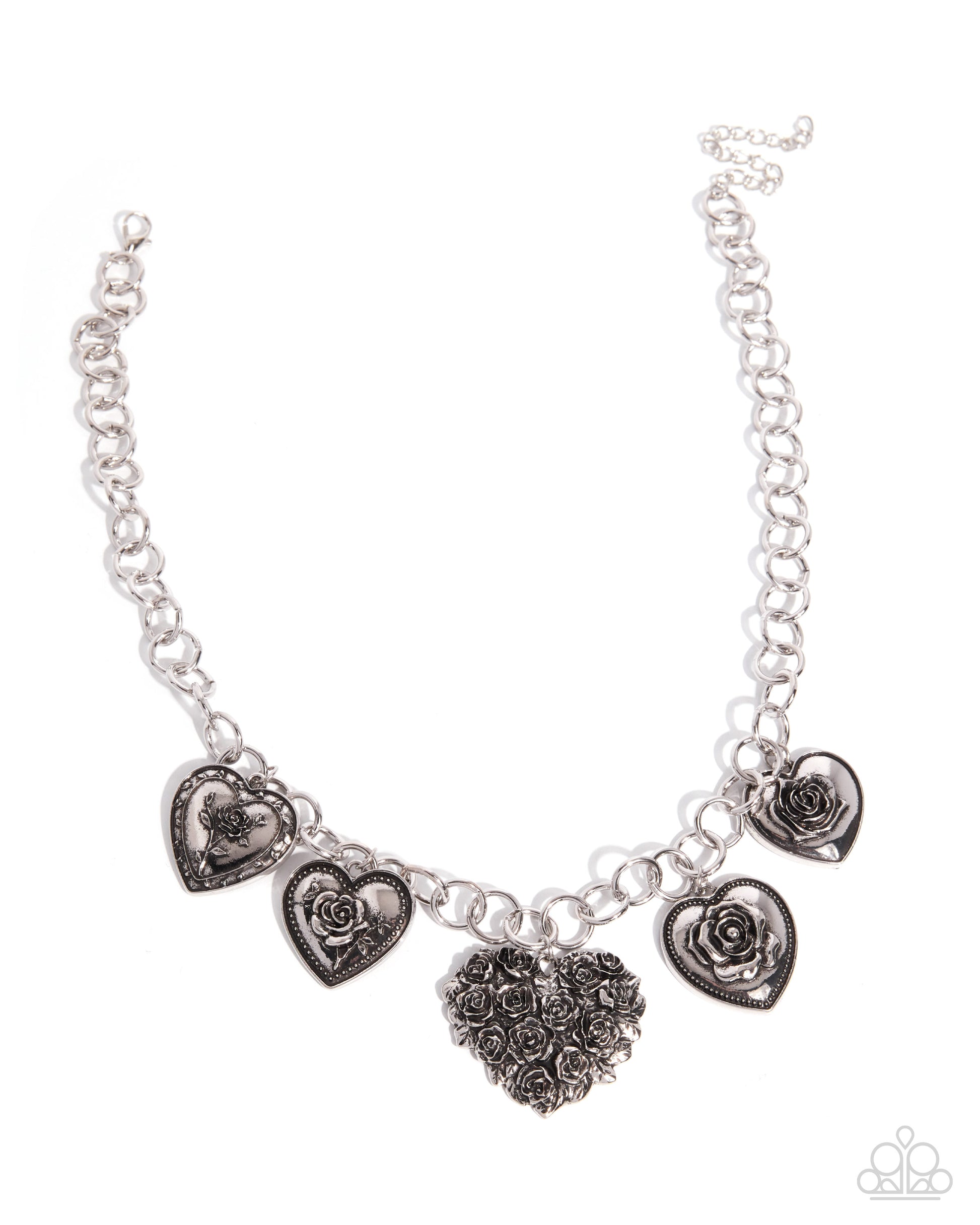 Silver necklace with heart-shaped charms on a white background