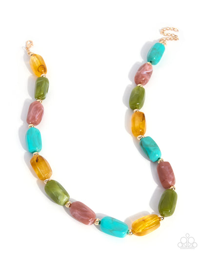 A beaded necklace featuring alternating translucent oval beads in turquoise, olive green, dusty rose, and amber orange, separated by small gold spacers, with a gold chain clasp on a white background.