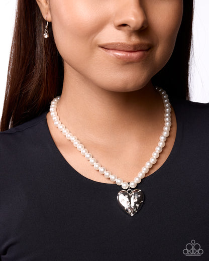 Close-up of Charming Cadence rhinestone heart pendant