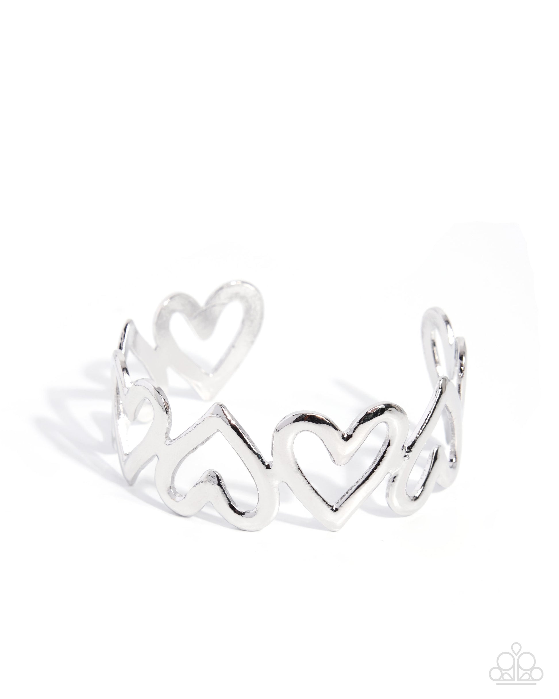 A silver open cuff ring featuring a continuous pattern of interlocking hearts, photographed on a clean white background with a soft shadow.