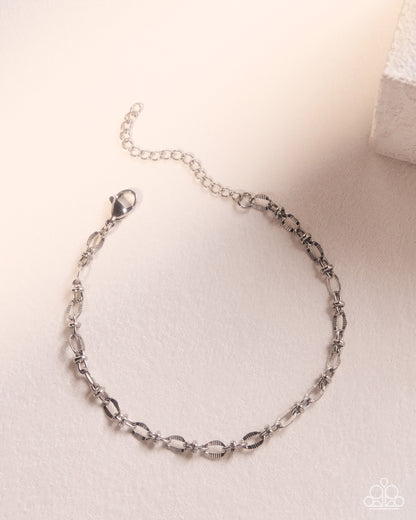Close-up of adjustable Simple Story silver bracelet