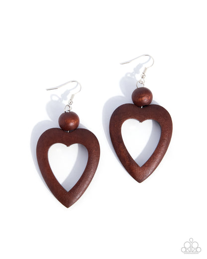 A pair of wooden heart drop earrings with a polished dark brown finish, featuring a small round wooden bead and silver fishhook wires, shown on a clean white background.