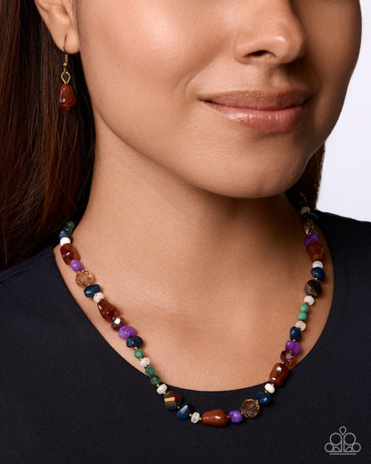 Close-up of multicolored stones and brass beads in Shameless Stones necklace