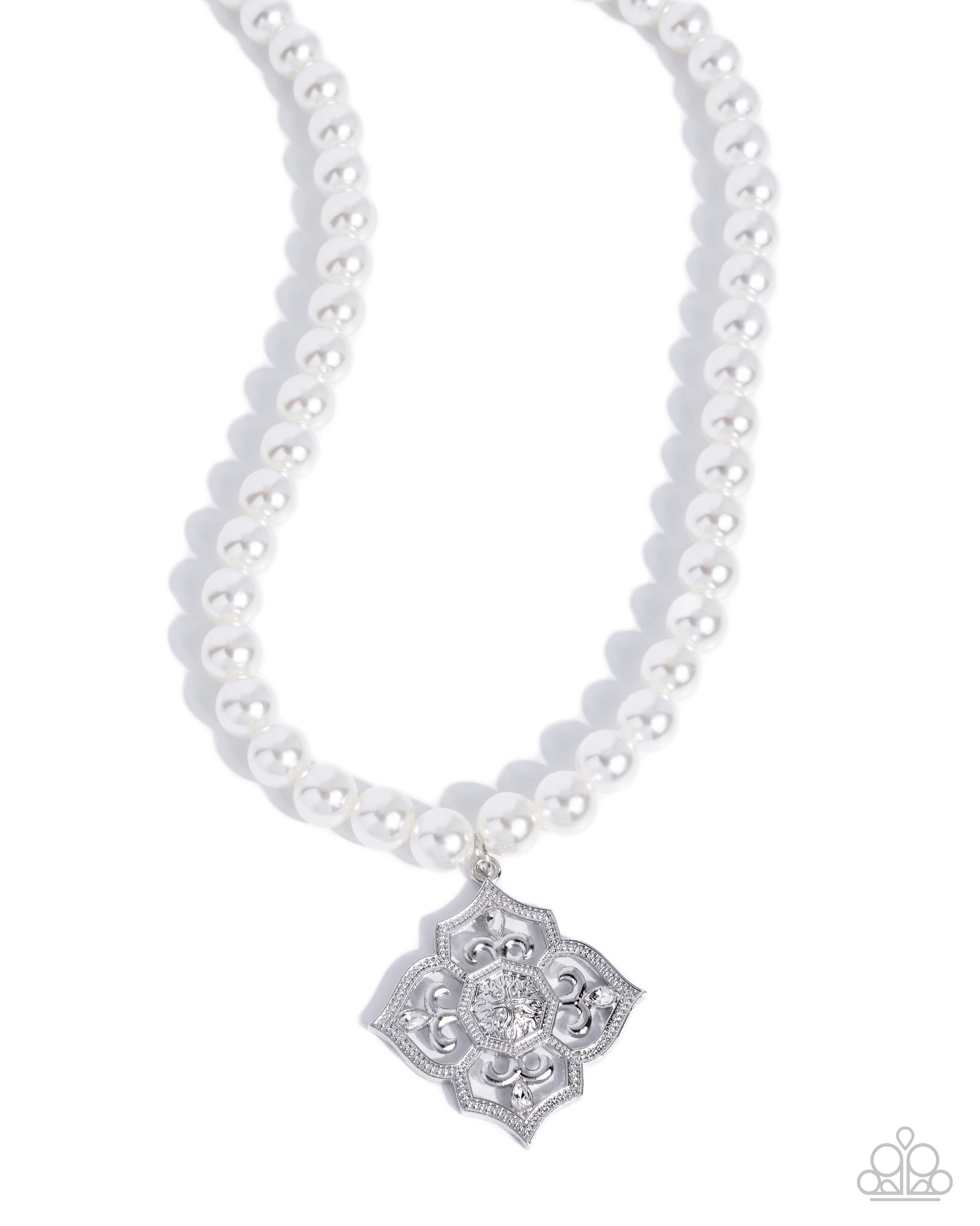 A white pearl necklace with a silver filigree pendant featuring a clear central stone, shown on a clean white background.