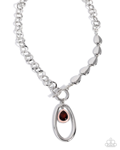 Shimmering Sonnet silver necklace with topaz gem and peach pearl accent