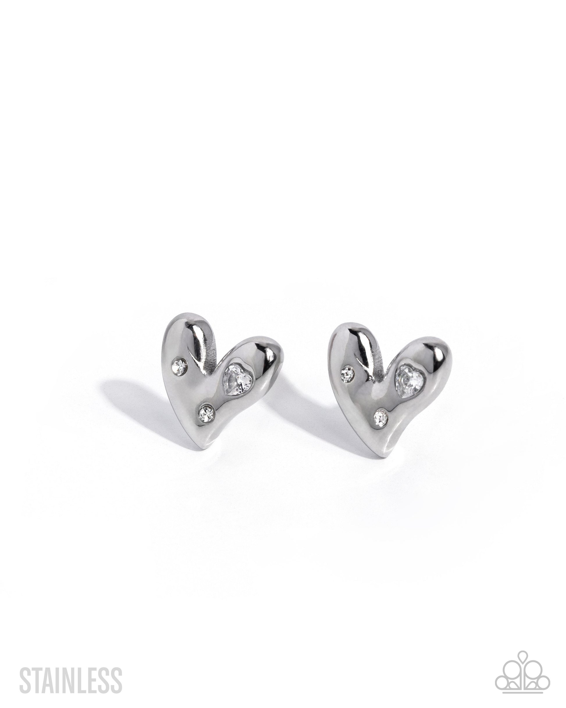 A pair of polished stainless steel heart-shaped stud earrings with small clear crystal accents, shown on a clean white background with soft shadows.