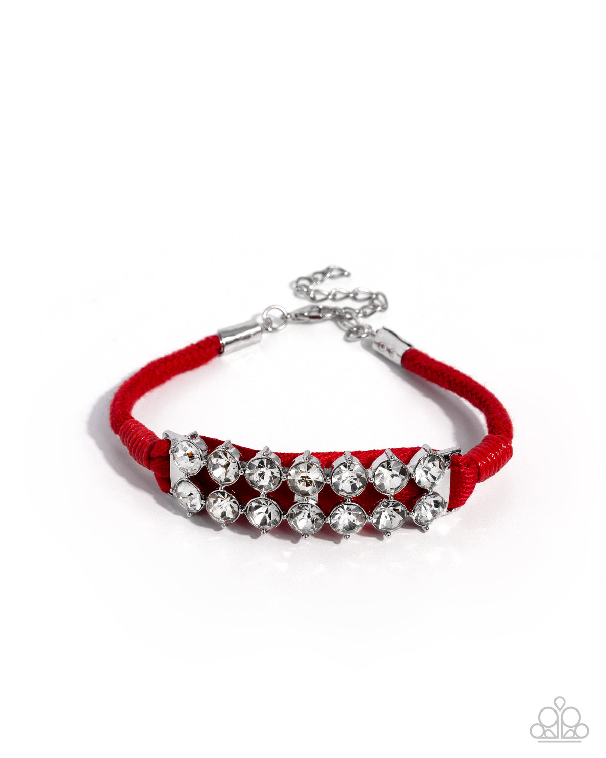 A red cord bracelet with a silver-tone chain extender and a central row of clear rhinestone-like beads, shown on a white background with a small Paparazzi logo watermark in the lower right corner.