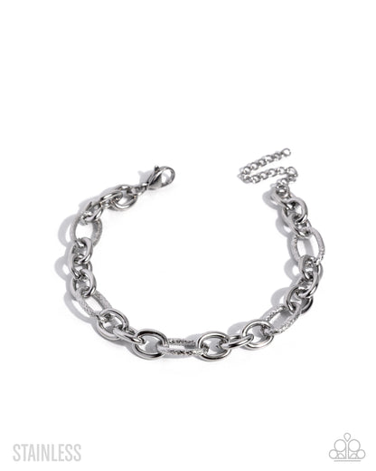 A silver stainless steel chain link bracelet with a lobster clasp and extender chain, displayed on a clean white background with brand watermarks.