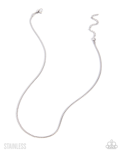 A silver stainless steel snake chain necklace with a lobster clasp and extender, displayed on a clean white background with brand text and logo.