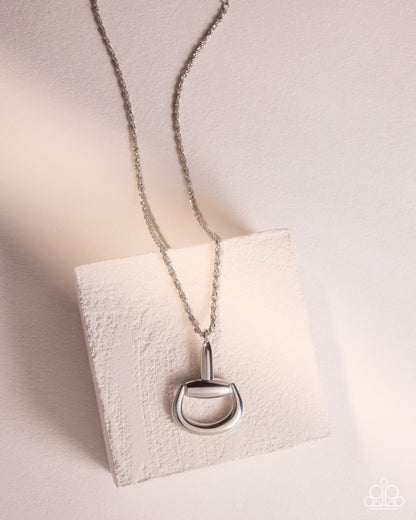 Close-up of Stirrup Season silver stirrup necklace on a model