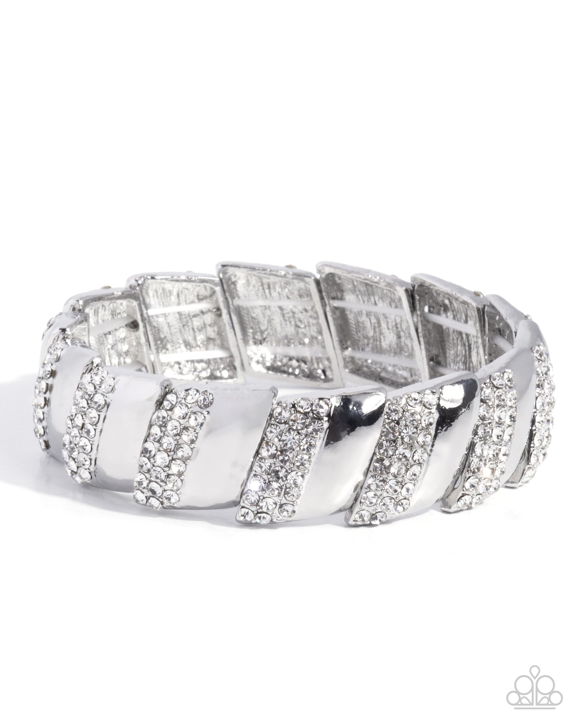 A wide silver-toned band ring featuring alternating raised rectangular panels and diagonal striped sections, all embellished with clear rhinestones, photographed on a white background.