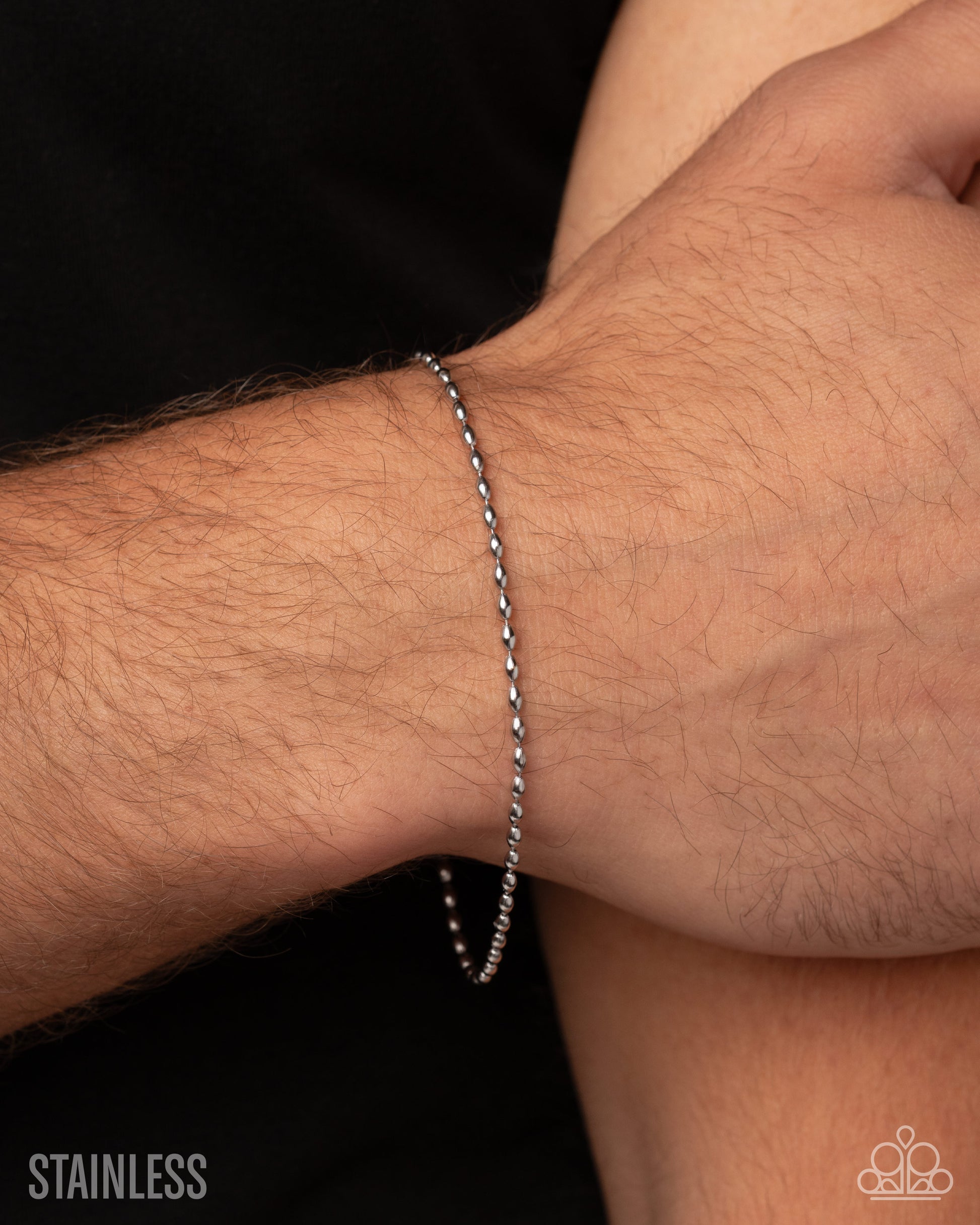 Seamless Standout silver ball-chain bracelet worn on wrist