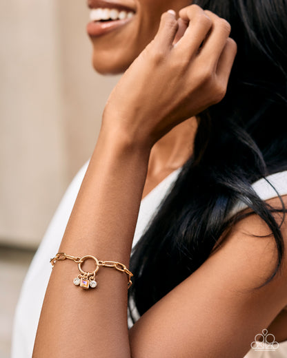 Totally Talented yellow charm bracelet worn on wrist