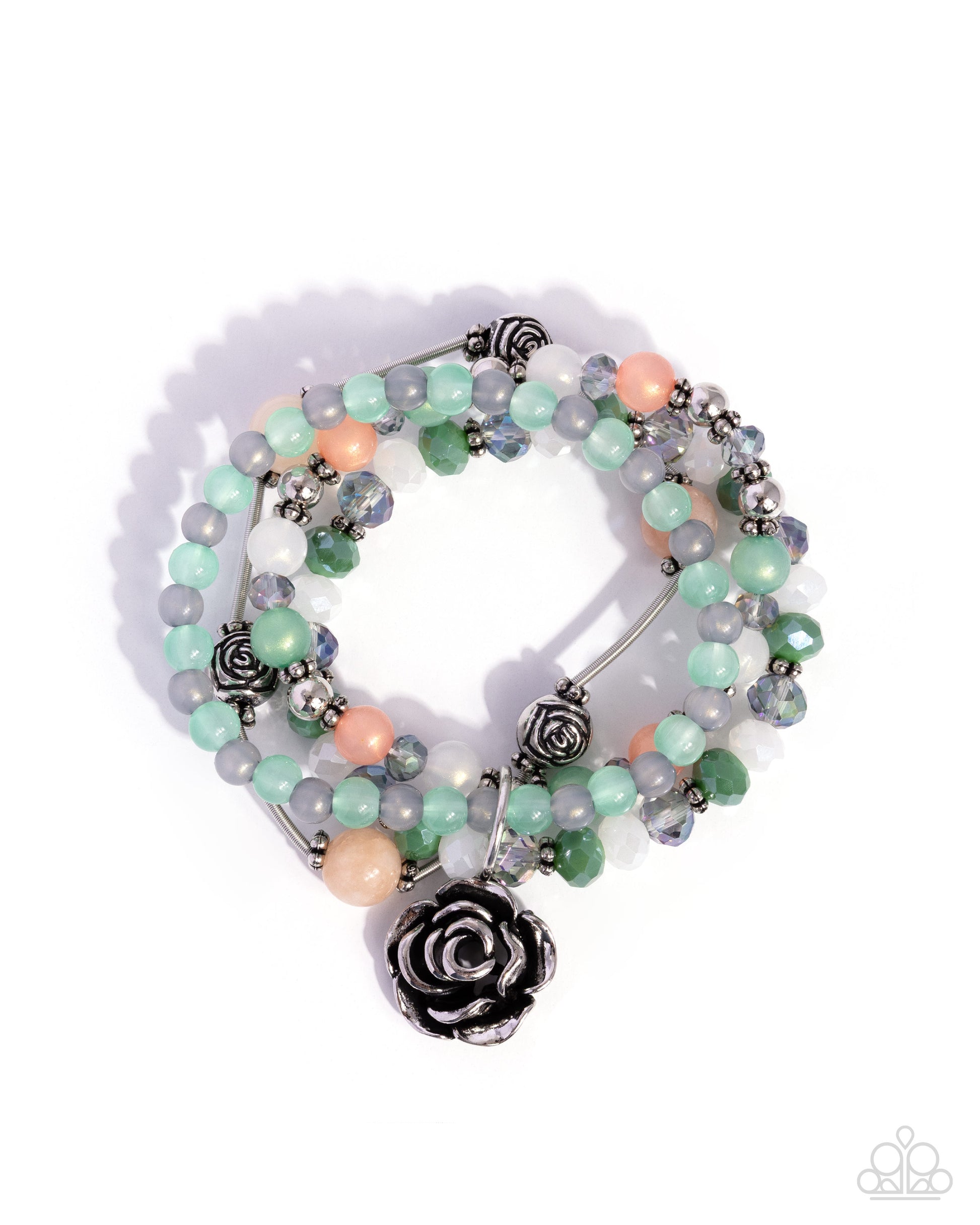 A multi-strand beaded bracelet with pastel green, peach, and gray beads, featuring silver-toned rose-shaped charms and a large black rose charm at the center, displayed on a white background with a soft shadow.