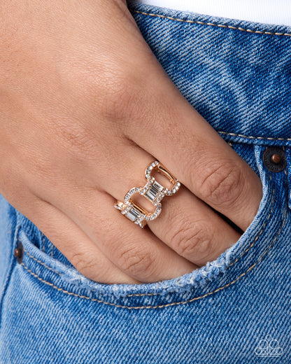 Interlocked Ideology gold chain-link stretch ring with white rhinestones and emerald-cut gems - Paparazzi Accessories at Jewelry by Bretta
