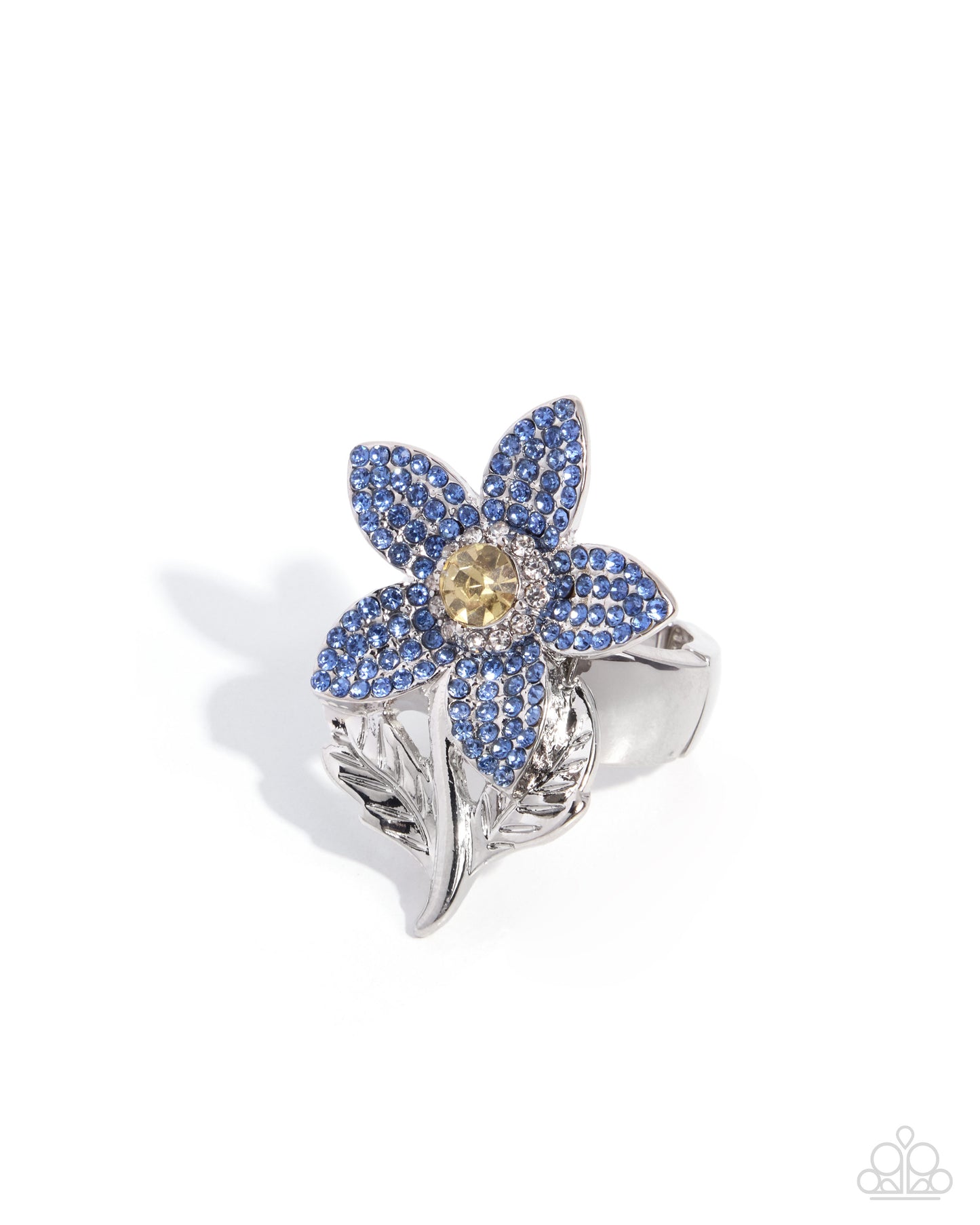 A silver-toned flower ring featuring blue pavé-set petals and a yellow center stone, photographed on a clean white background.