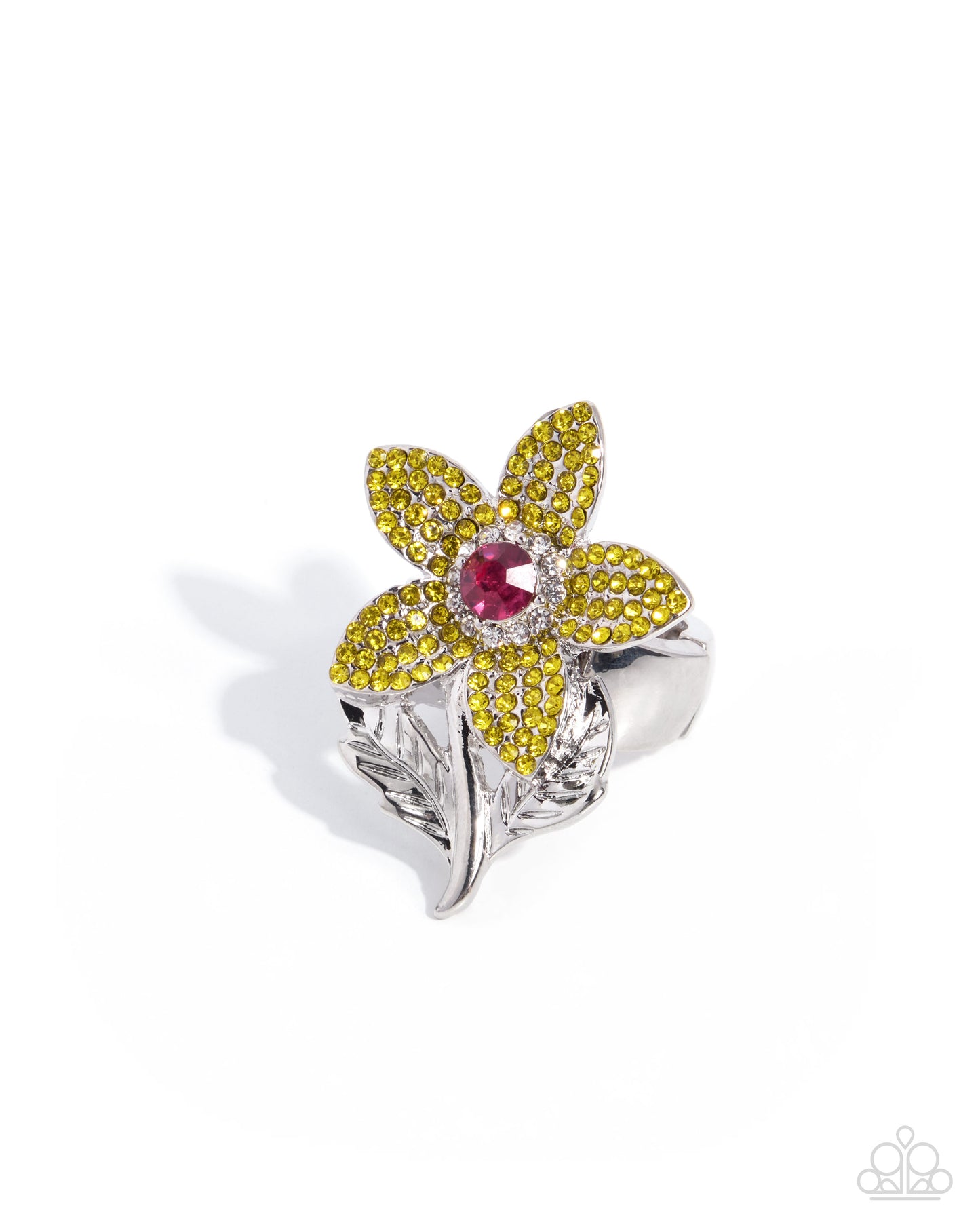 A silver ring designed as a flower with bright yellow pavé petals, a central red gemstone, and a leaf-shaped silver band, shown on a white background.