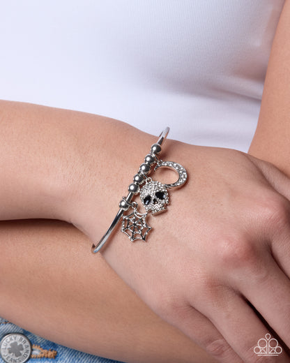 Halloween Habit white rhinestone silver cuff bracelet worn on wrist