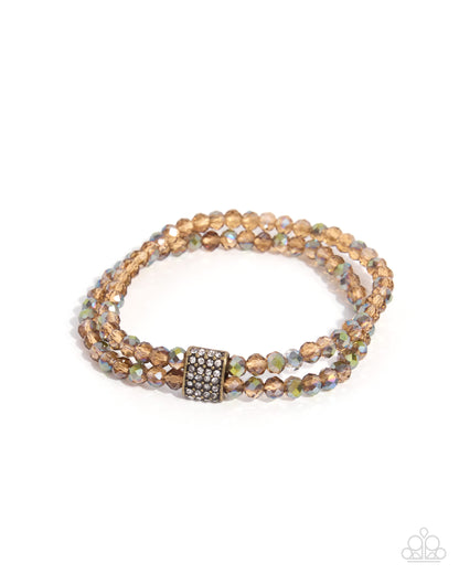 Engaged Elegance brass stretch bracelet with peach shimmer beads and white rhinestone accents by Jewelry by Bretta