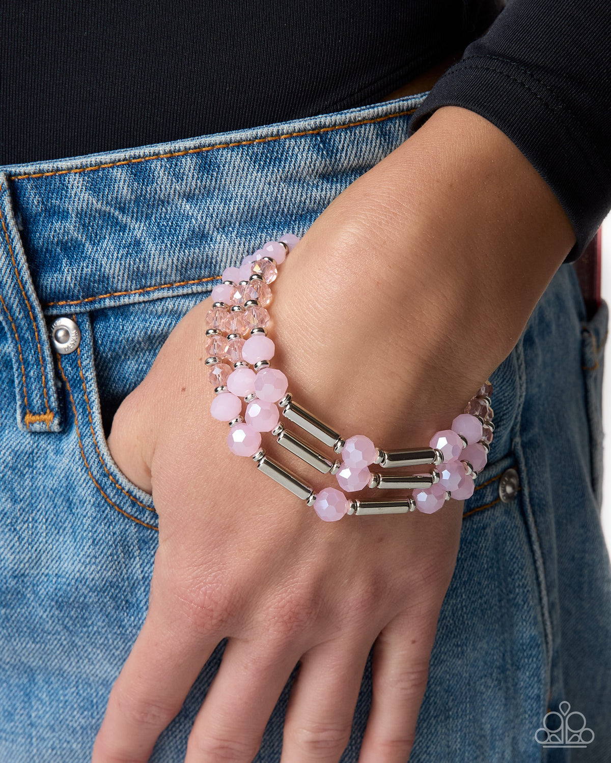 Close-up of Legato Law pink bead and silver accent bracelet