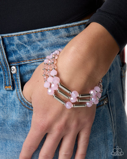 Close-up of Legato Law pink bead and silver accent bracelet