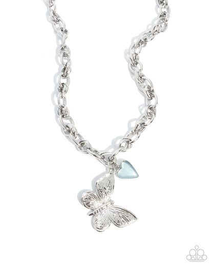 Budget Butterfly silver butterfly pendant necklace with blue cat's eye heart charm - Paparazzi Accessories at Jewelry by Bretta