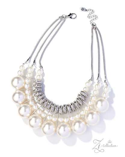 Pearl necklace with silver accents on a white background, featuring the ZI Collection brand.