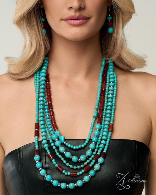 A close-up of a model wearing a multi-strand turquoise and dark red beaded necklace with matching drop earrings, styled with a black strapless top.