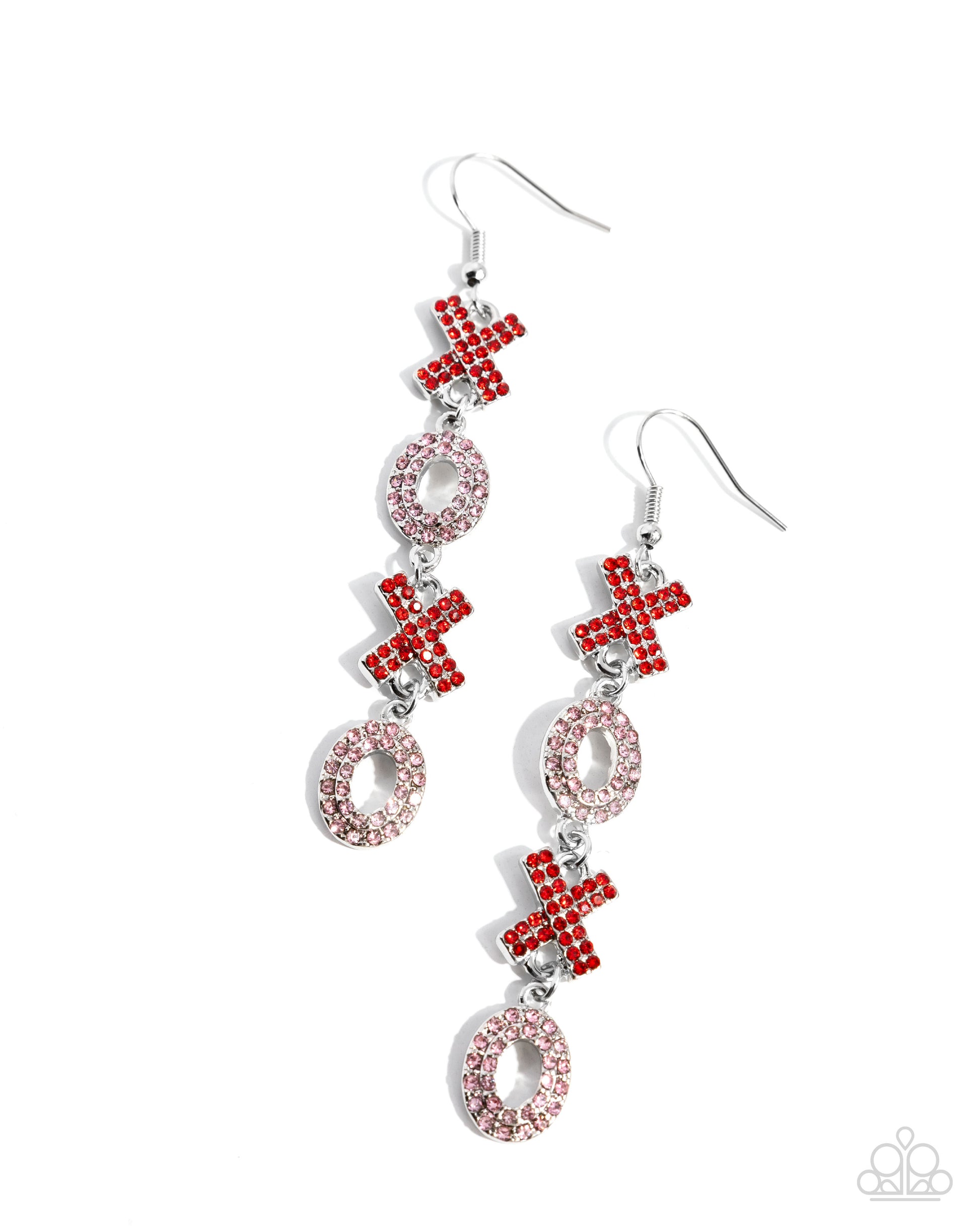 Pair of earrings with red and silver designs on a white background