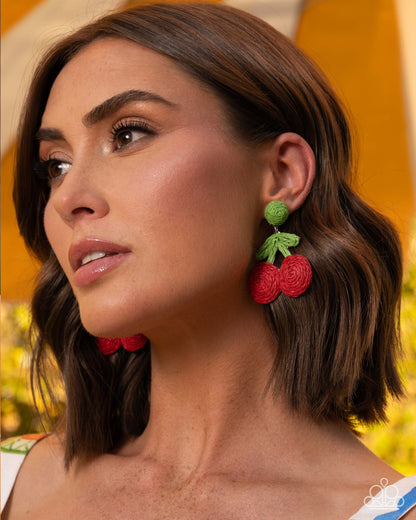 Crafted Cherry red raffia earrings displayed on jewelry card